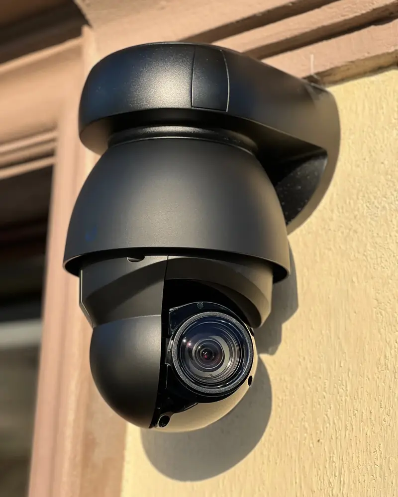Dome camera on a stucco wall