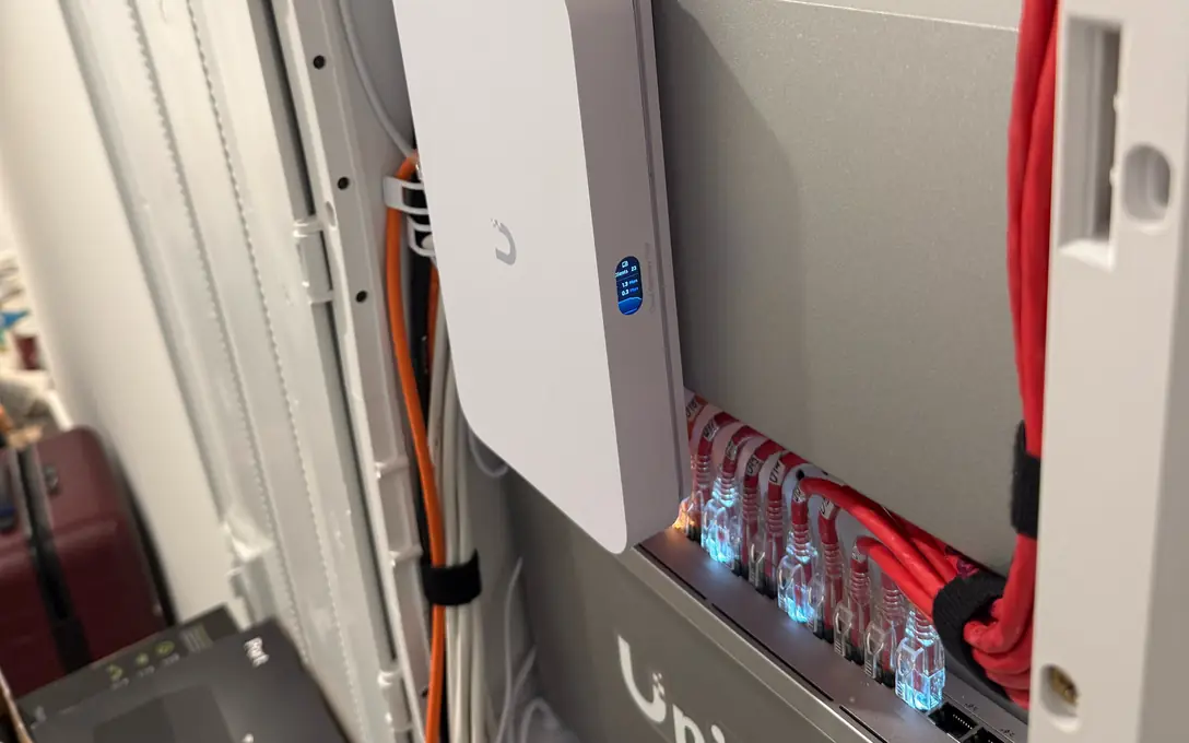 UniFi Cloud Gateway Fiber and switch in a recessed enclosure