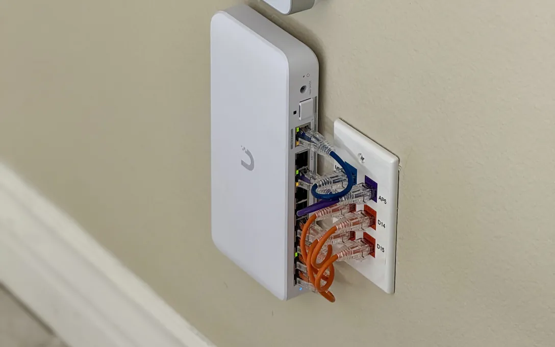 UniFi in-wall access points beside a patch plate