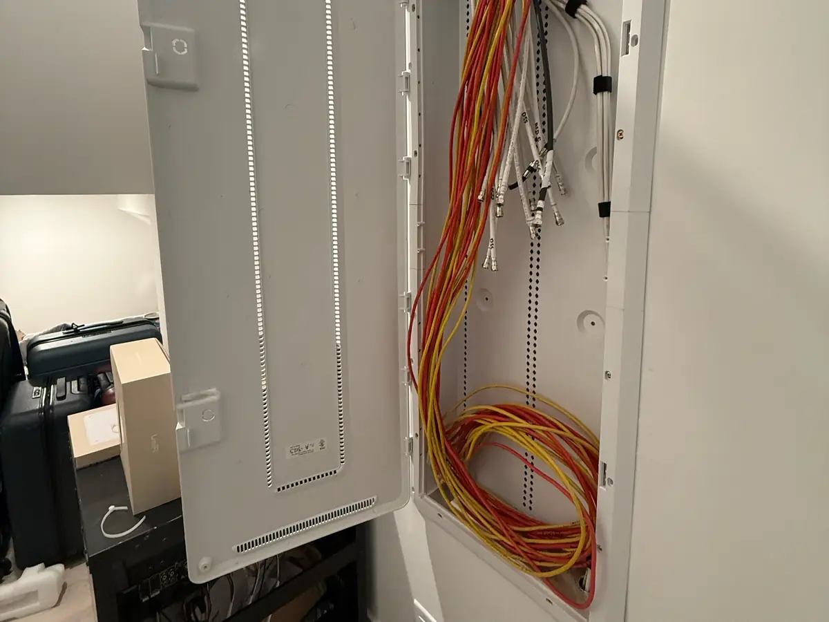 Recessed enclosure with loose network cable and coax