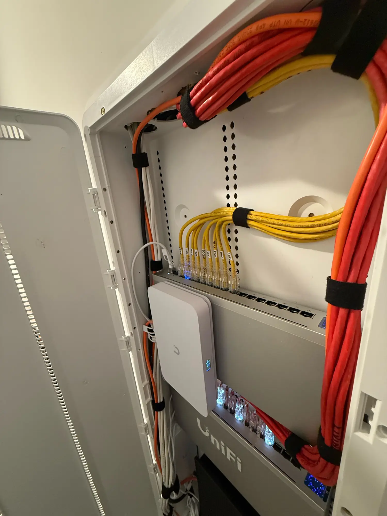 UniFi switch with labeled patch cables