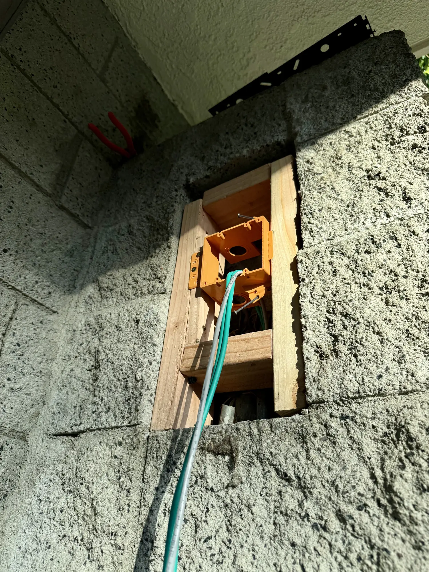 Wood frame and low-voltage box in the pillar cutout