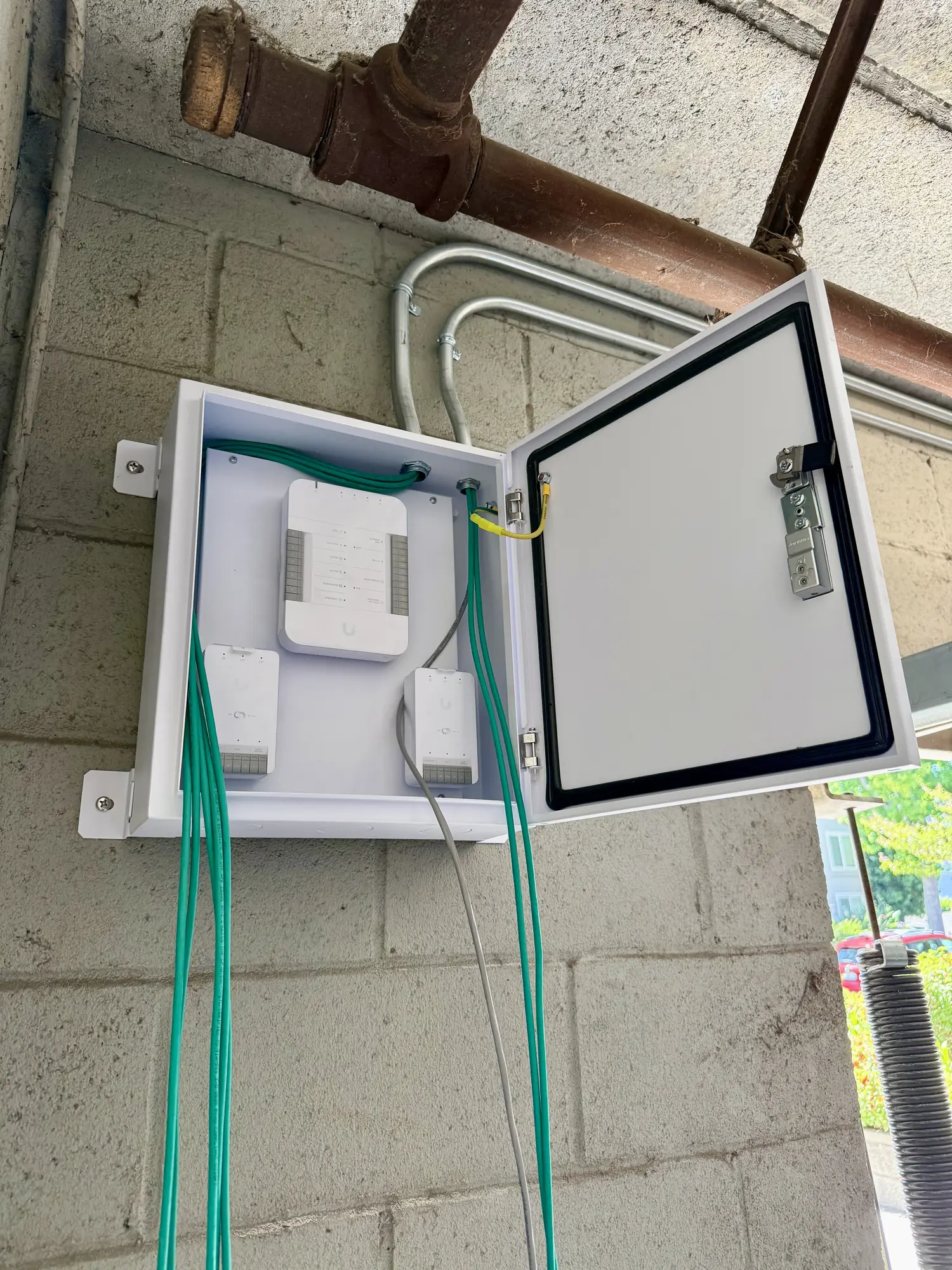 UniFi Access hubs on the enclosure back panel