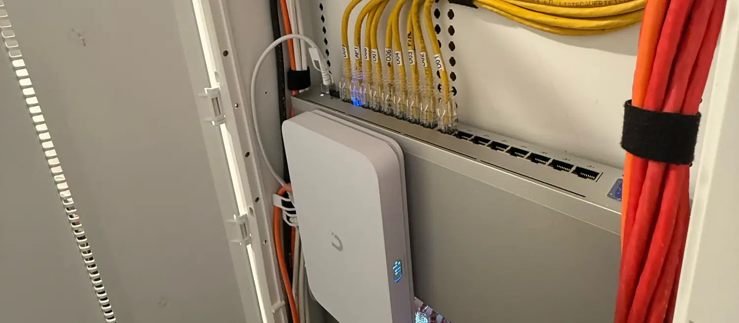UniFi switch with labeled patch cables