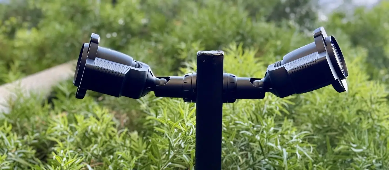UniFi Protect bullet cameras on a black post