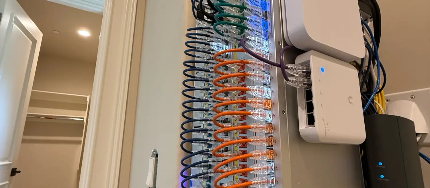 Wall-mount UniFi rack in a walk-in closet