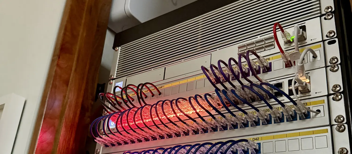 UniFi rack in a wood framed alcove
