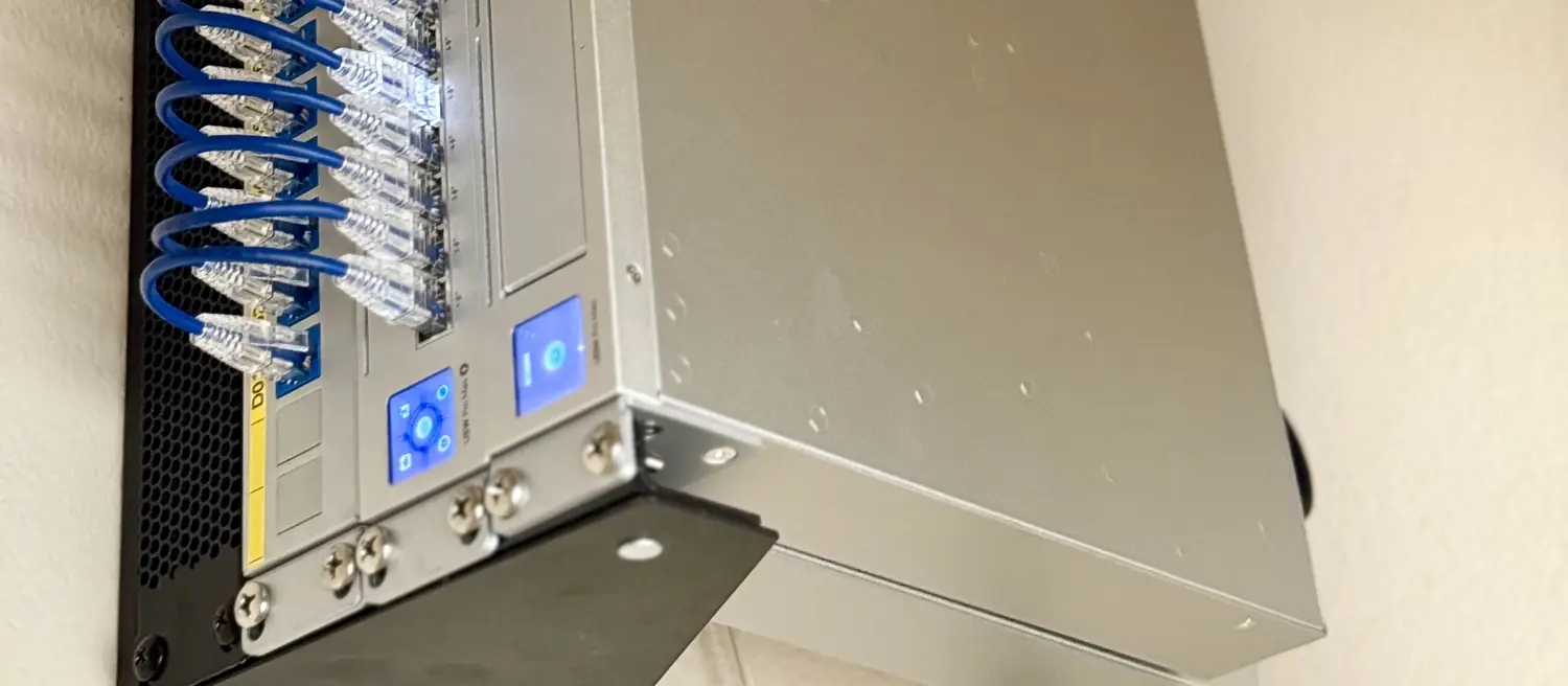 UniFi gateway and switch on a wall bracket