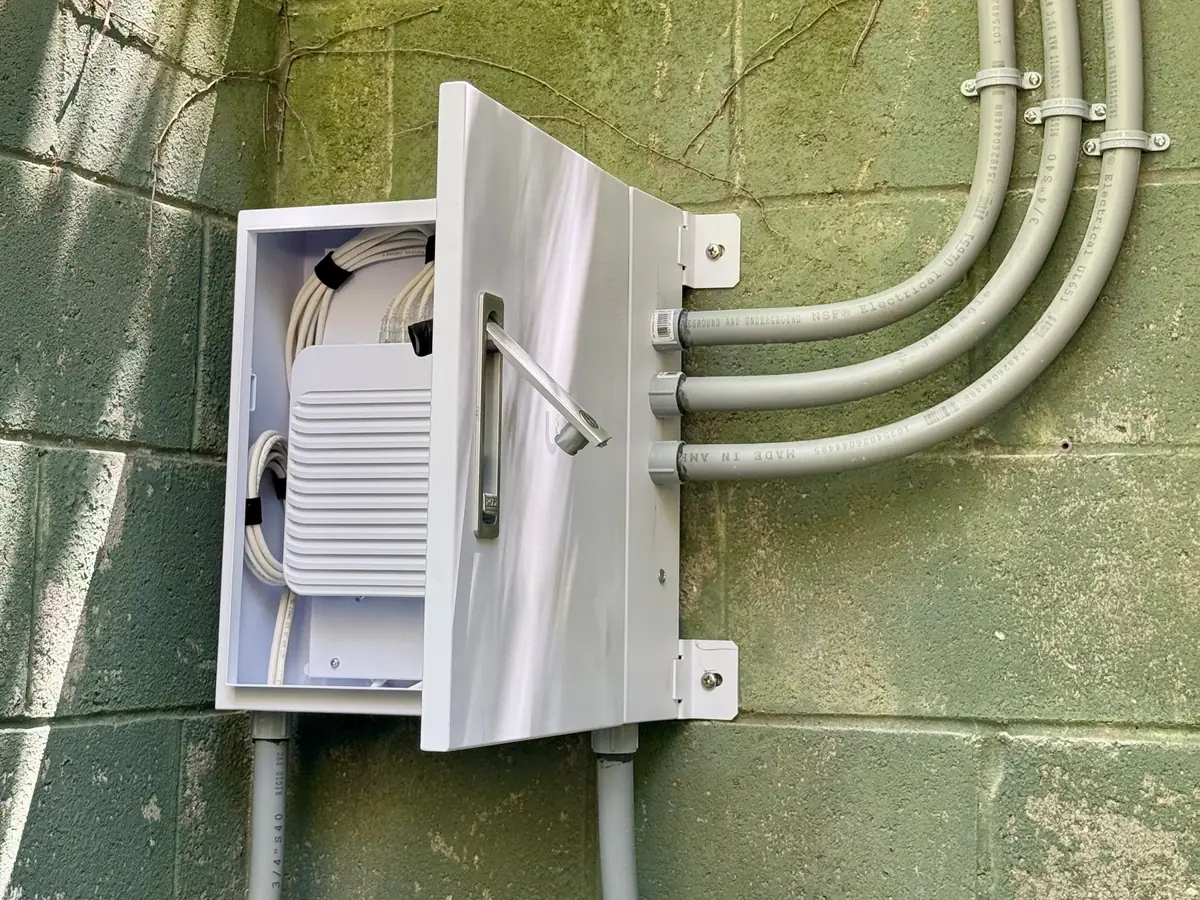 Weatherproof switch enclosure on a block wall