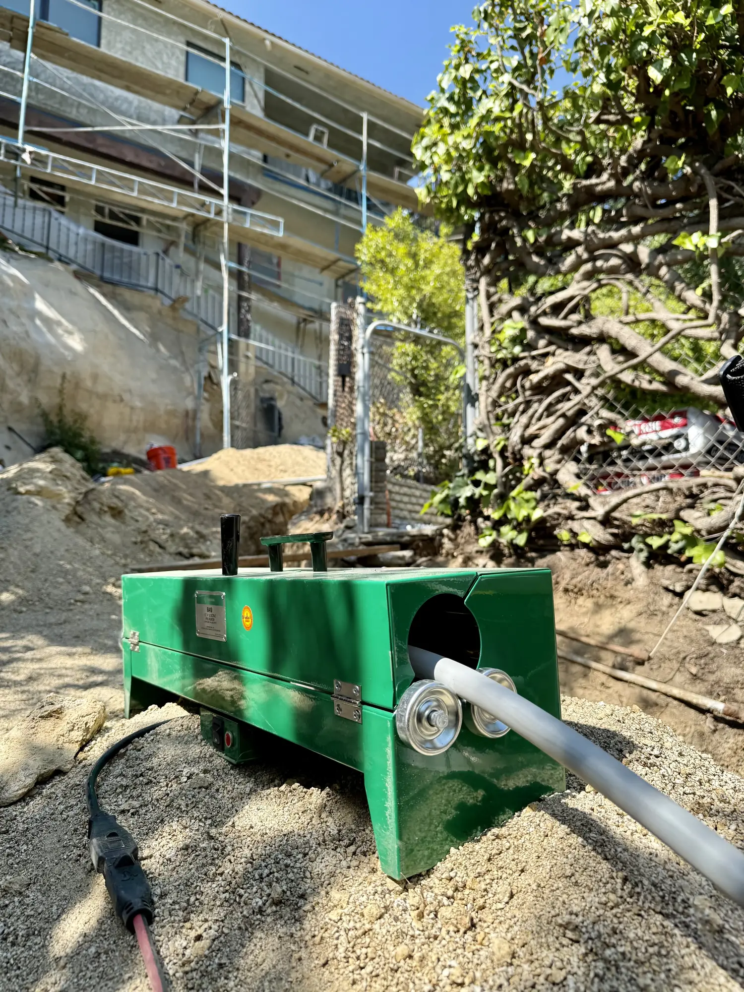 Fiber blowing machine feeding conduit
