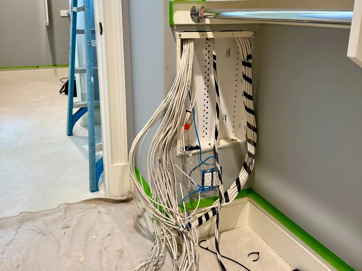 Cables hanging from the old recessed enclosure