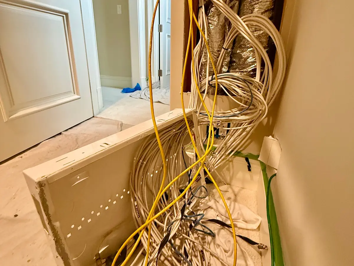 Old cable pulled out of the wall opening