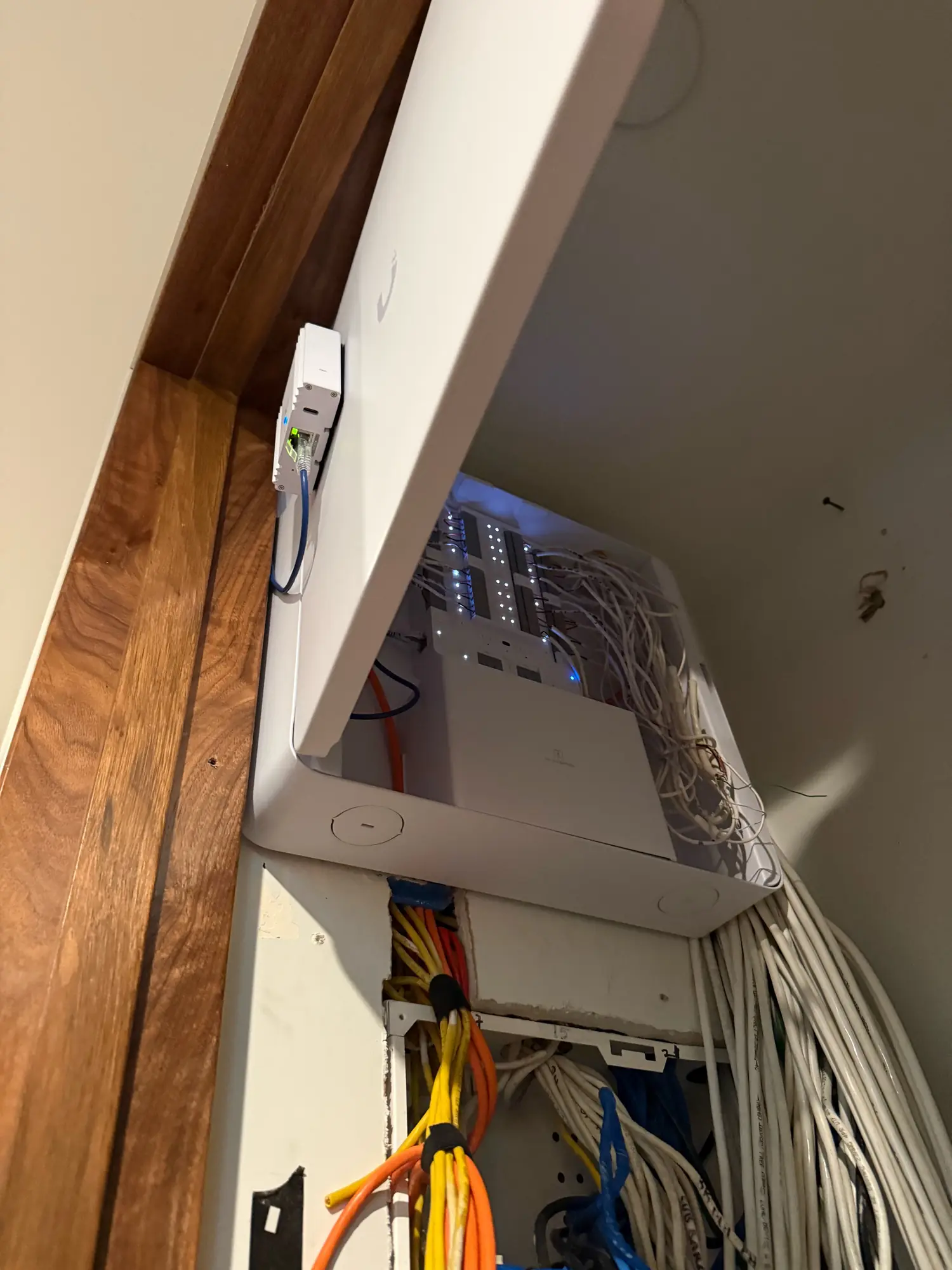 UniFi wall enclosure under the staircase, open