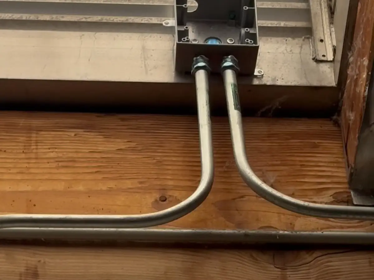 Conduit and junction box for a camera position