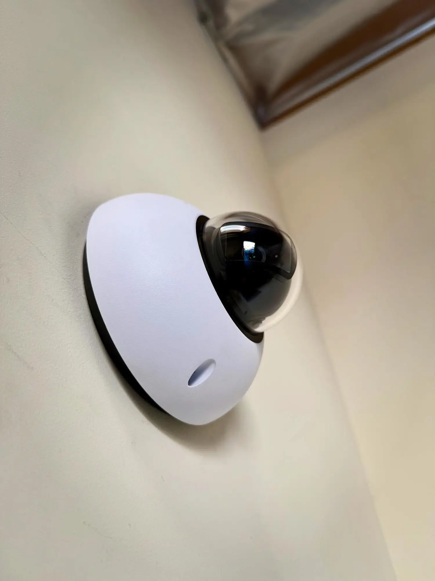 UniFi Protect dome camera on a wall
