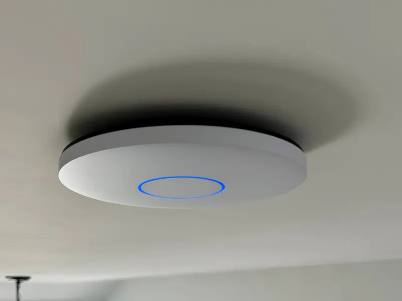 UniFi access point on a ceiling