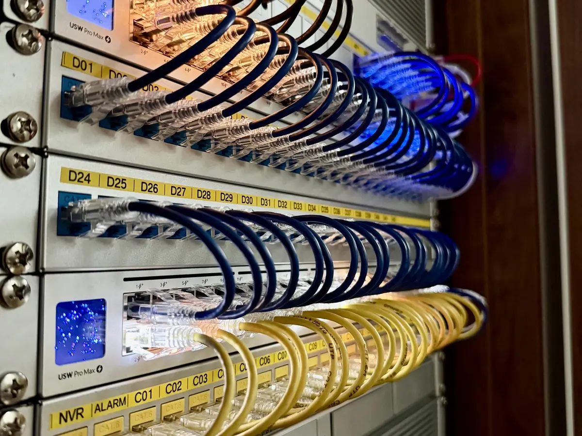 Patch panels and a switch with labeled ports