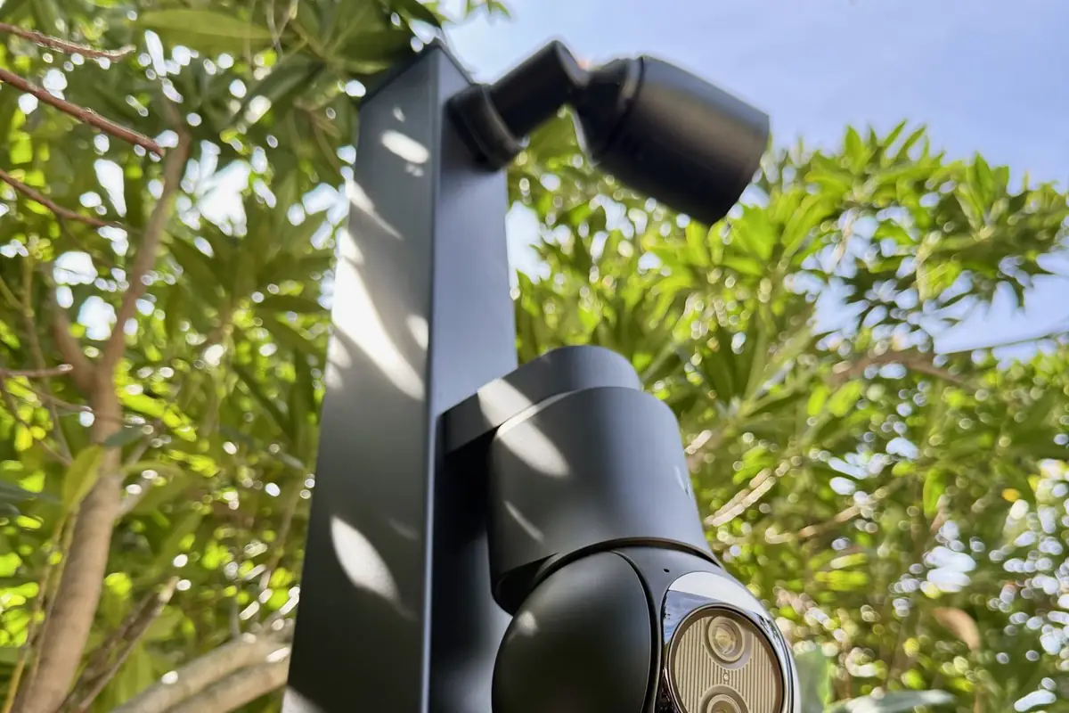 Two cameras on a square black metal post