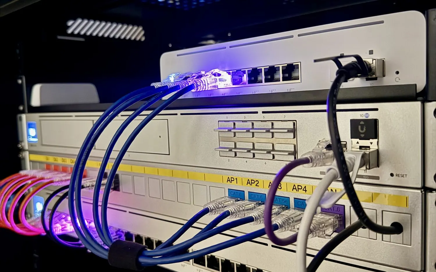 UniFi switch and patch cables in a rack