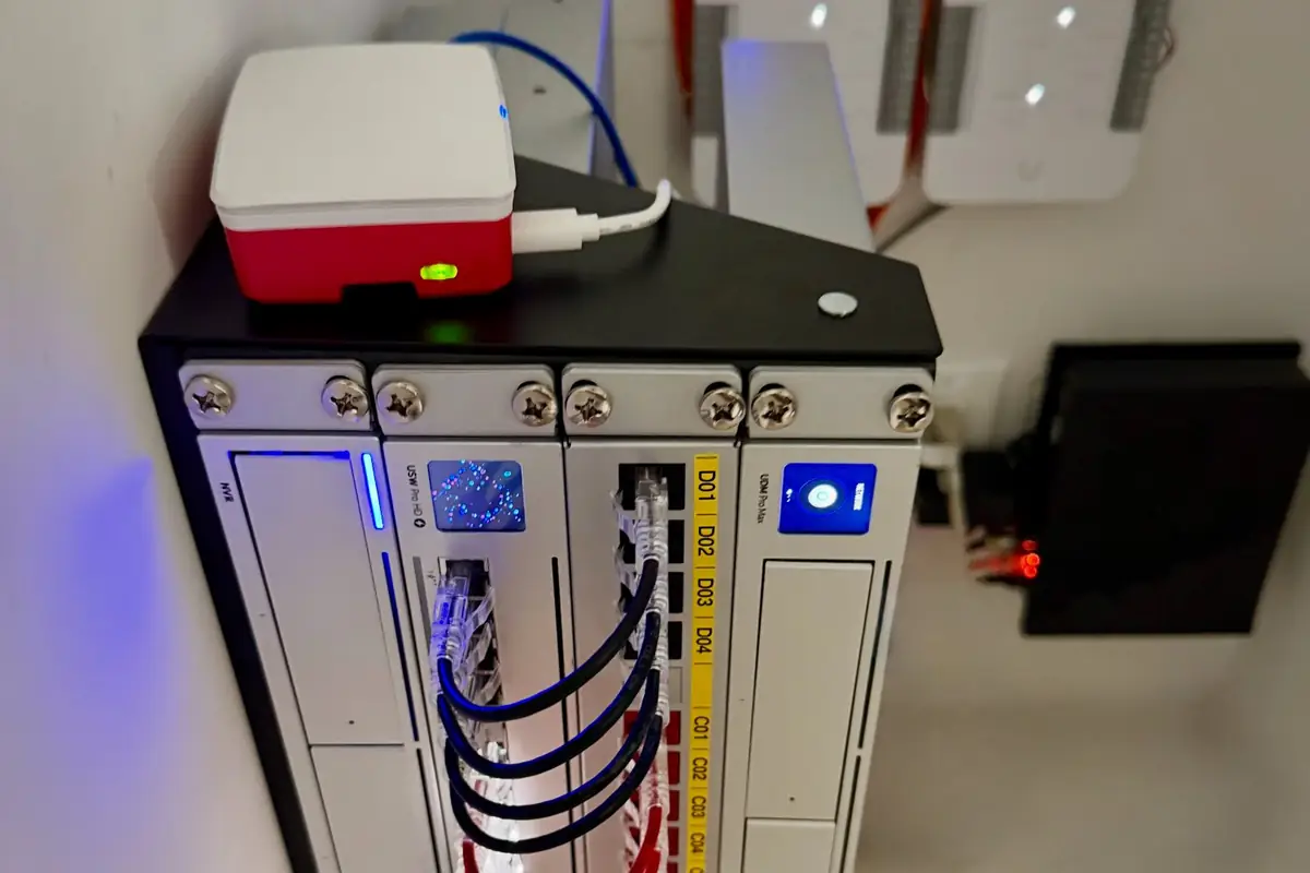 Wall-mounted UniFi rack with two Access hubs above it