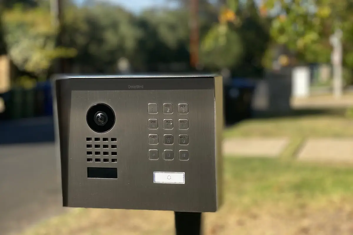 DoorBird entry unit with keypad on a gate pedestal