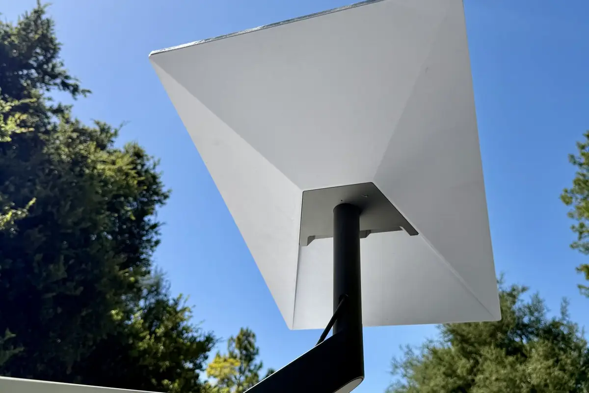 Starlink dish on an arm bolted to a roofline