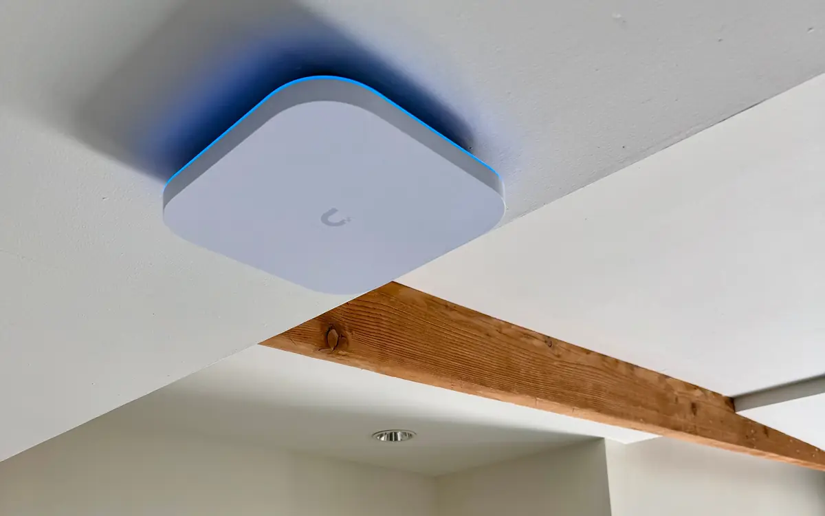 UniFi access point on a white ceiling