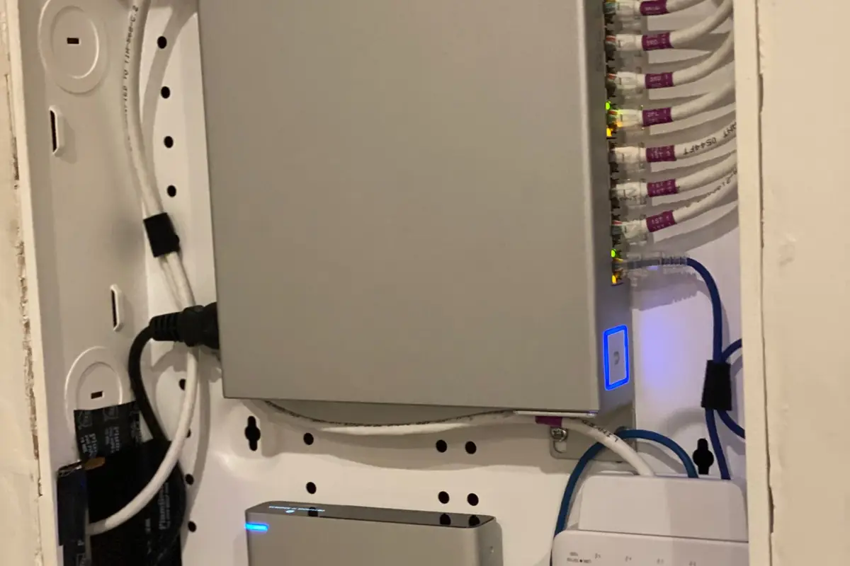 Recessed wall enclosure with a UniFi switch