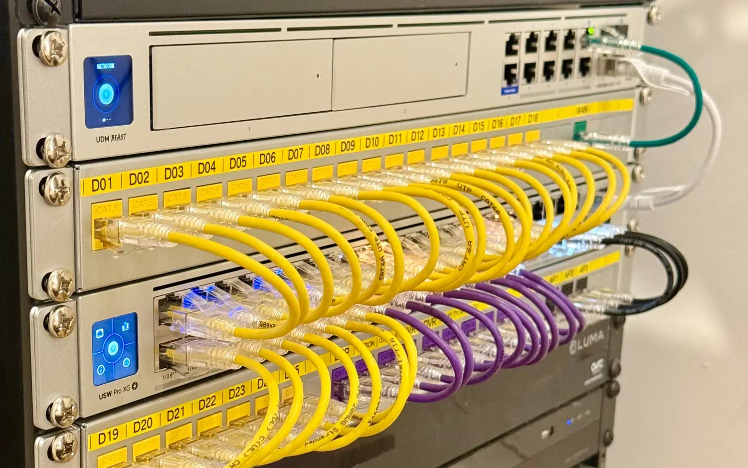 Patch cables looped into a labeled patch panel